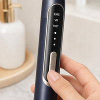 Selecting EMS, VR or HOT mode on the eye massager control panel